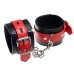 Черные наручники с красными ремешками - фото